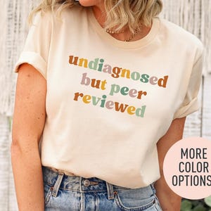 a woman wearing a t - shirt with the words unigaged but peer reviewed