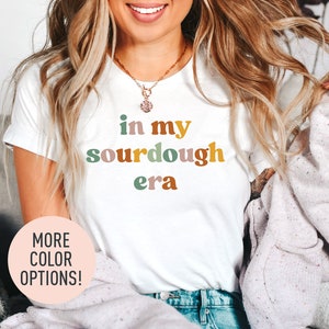 a woman wearing a t - shirt that says in my sourdough era