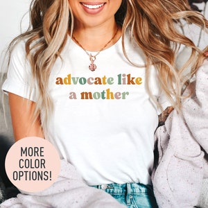 a woman wearing a t - shirt that says, adocate like a mother