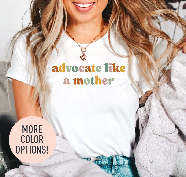 a woman wearing a t - shirt that says, adocate like a mother