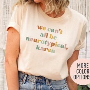 a woman wearing a t - shirt that says we can't all be ne