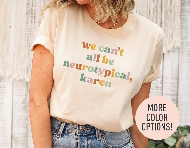 a woman wearing a t - shirt that says we can't all be ne