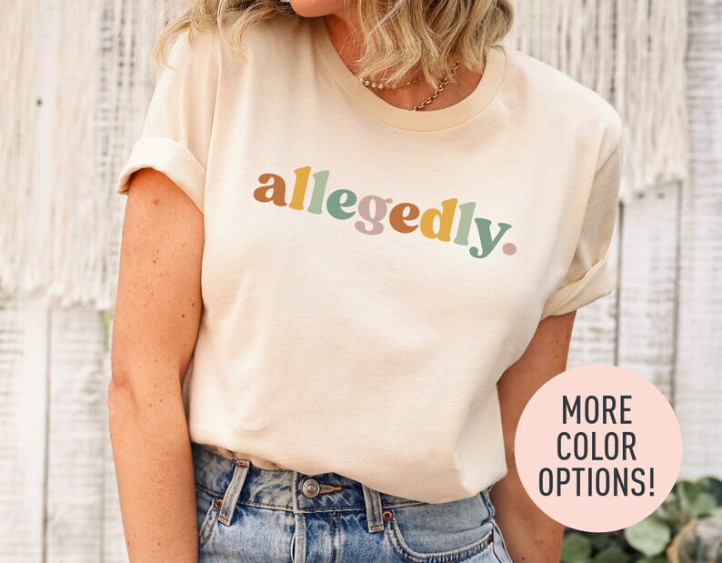 a woman wearing a tee shirt with the word'allegdy'printed on
