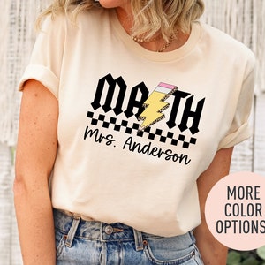 a woman wearing a t - shirt that says math is awesome