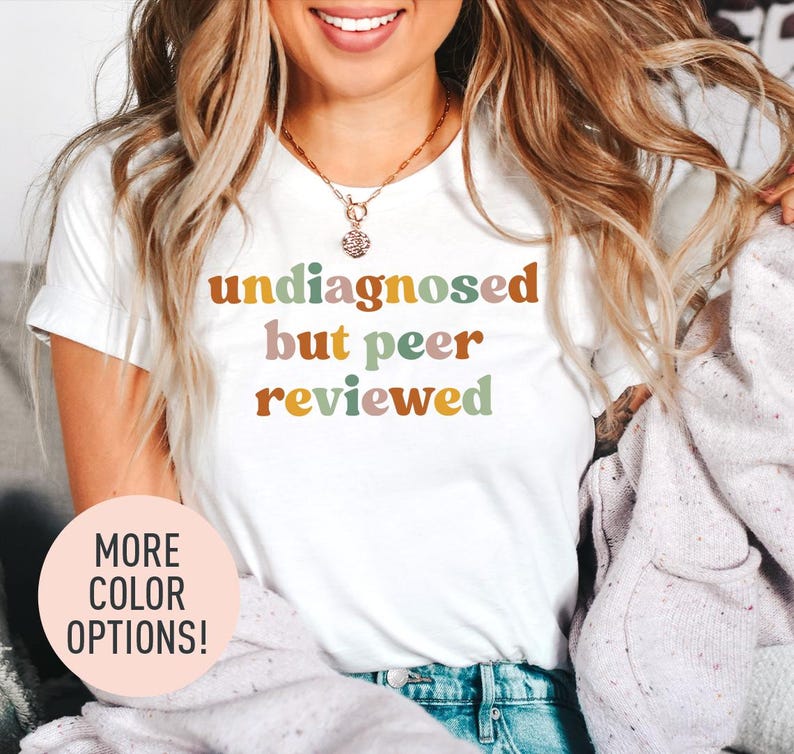 a woman wearing a t - shirt that says undiagnosed but peer reviewed