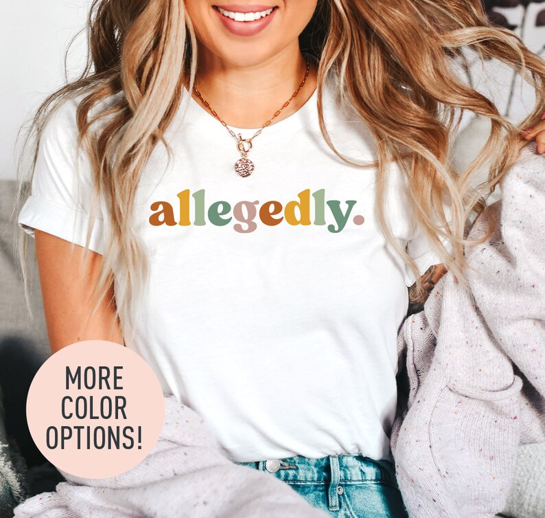 a woman wearing a white shirt with the word algedy on it