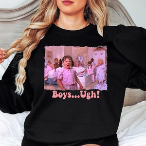 May include: Black sweatshirt with a pink graphic of a girl saying "Boys... Ugh!" The graphic is from the movie "Mean Girls".