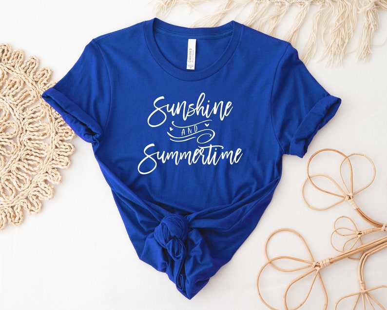 May include: A royal blue t-shirt with white text that reads "Sunshine and Summertime".