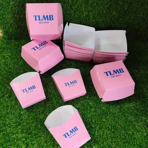 May include: A set of three ceramic mugs with a speckled, matte finish in cream, light brown, and dark brown. Each mug has a simple design and a rounded handle.