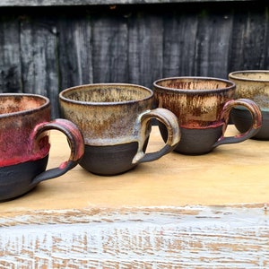 Handmade and hand painted 350ml black stoneware mugs