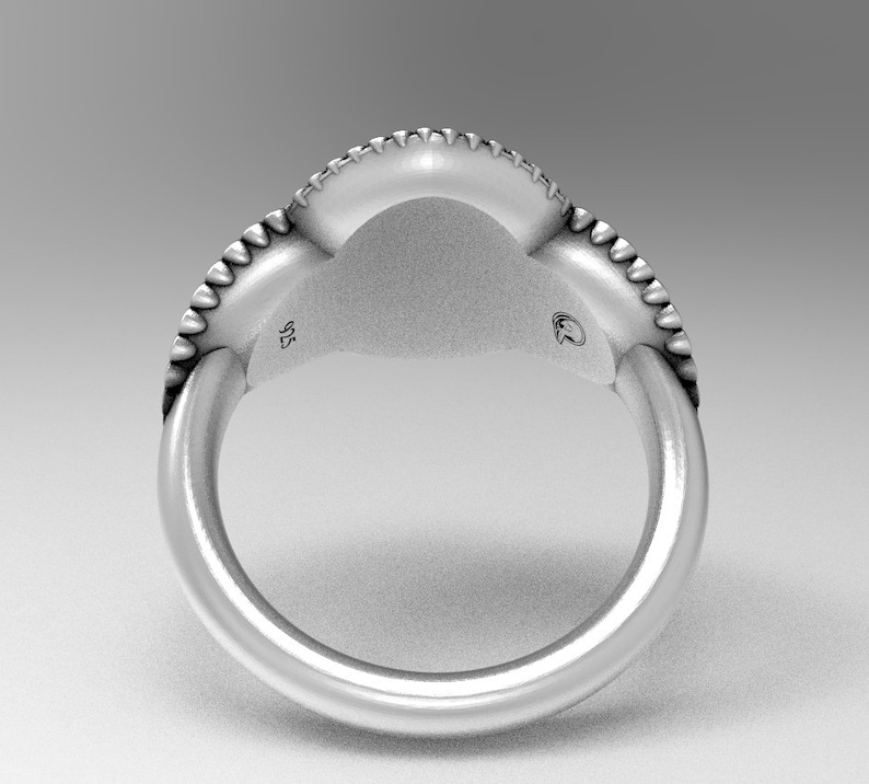 May include: Silver ring with a textured band and a smooth, rounded top. The ring is marked "925" on the inside.