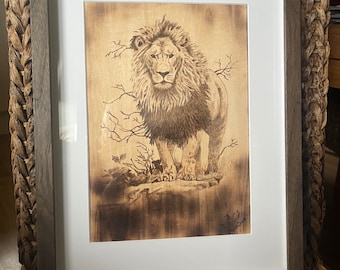 Pyrography engraved by hand, lion on plywood in frame.