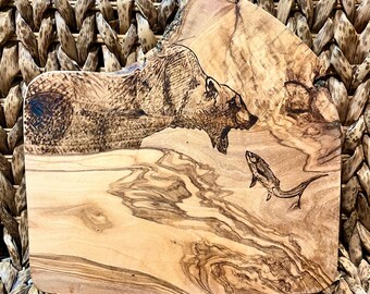 Olive wood stylised bear catching salmon panel