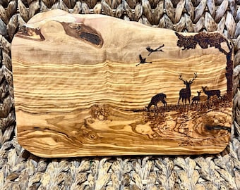 Olive wood scene with deer grazing