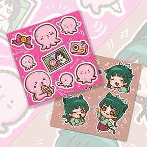May include: Two sticker sheets with cartoon illustrations. One is pink with pink octopus characters, a camera, and a photo. The other is tan with green-haired anime-style characters. The stickers have a cute, playful design.