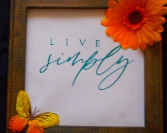 Live Simply sign chalked cheerful