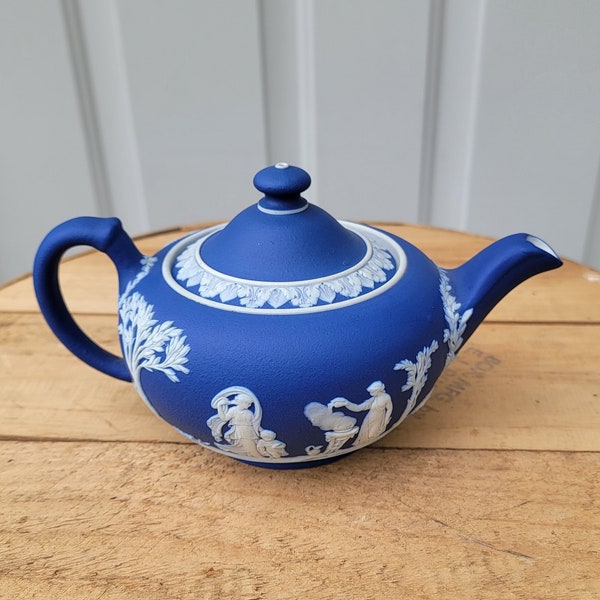 Wedgwood Cobalt blue Jasperware Tea Pot. It Measures 7-3/4"L Handle To Spout x 5"W x 4-1/4"H