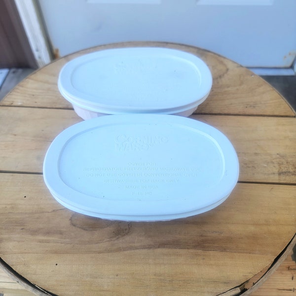 2 Corning Ware French White Oval 16 Oz Casserole With Storage Lid. 7-3/8"L x 4-7/8"W x 1-1/2"H