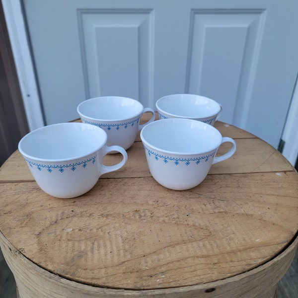 4 Corelle Blue Snowflake/Garland Tea Cups.   3-7/8"W x 2-5/8"H.