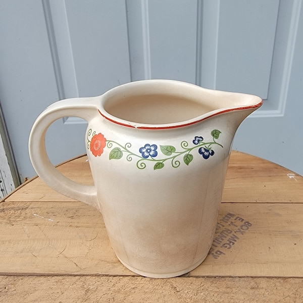 Cambridge Medium Sized Pitcher With Blue And Orange Flowers. 4-3/4"W x 6"H