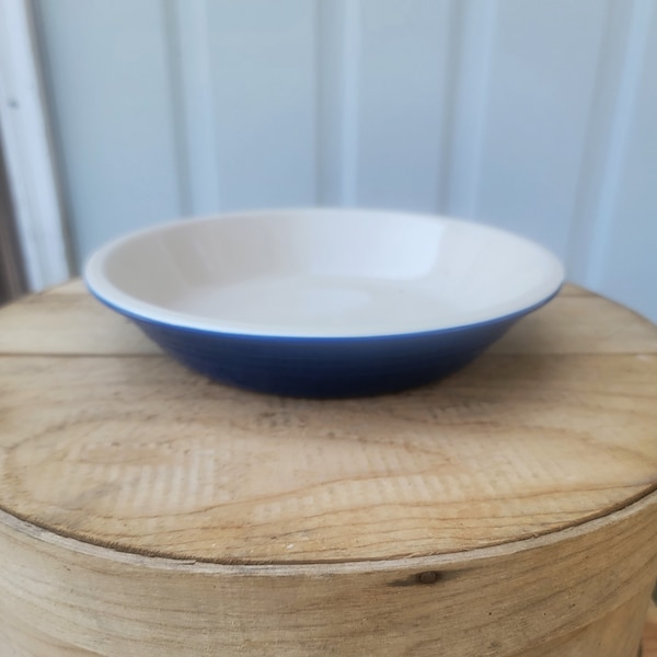 Le Creuset Blue Enameled Stoneware Pie Plate/Bake Dish. It Measures 9-7/8"W x 1-3/4"H