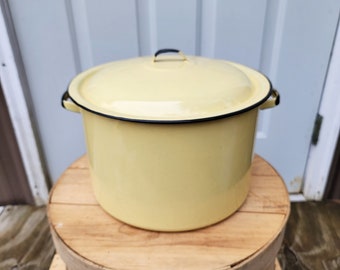 Large Enamelware Stock Pot Yellow With Black Trim.11-5/8"W x 7-3/8"H Without The Lid On & 9-1/2"H With The Lid On.