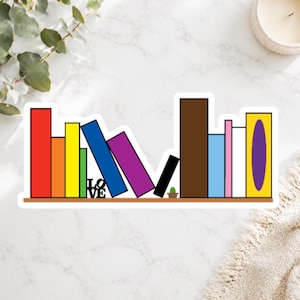 May include: A sticker featuring a bookshelf design with colorful books. The books are arranged on a brown shelf, with the word "LOVE" visible. A small cactus is also present. The books are in various colors, including red, yellow, blue, and purple.
