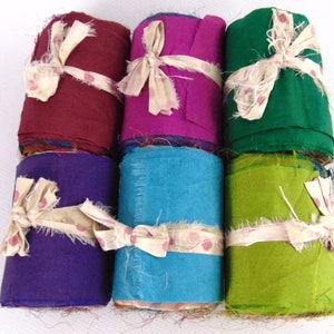 Sari silk rolls multicolour. Recycled silk fabric from India.