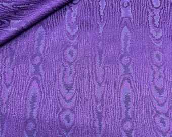 May include: Purple fabric with a woodgrain pattern. The fabric has a subtle sheen and a textured surface.