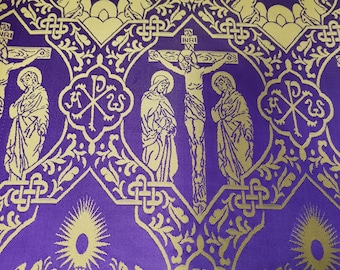May include: A purple fabric featuring a repeating gold pattern of religious iconography. The design includes depictions of the crucifixion with INRI text, figures of saints, angels in prayer, and the Chi Rho symbol, all interconnected by ornate knotwork.