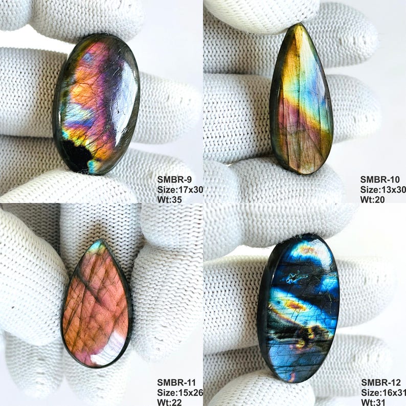 May include: Four polished labradorite gemstones in various shapes. The gemstones display iridescent colors of blue, purple, and gold. Each stone has a unique pattern and is displayed on a white surface. The sizes range from 13x30mm to 17x30mm.