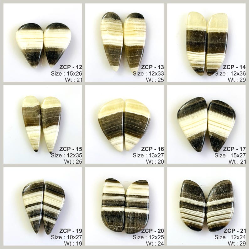 May include: A collection of nine pairs of polished gemstones, each with a unique shape and pattern. The stones feature a mix of cream, brown, and black bands. Each pair is labeled with a code, size in millimeters, and weight in grams.