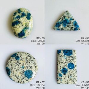May include: Four K2 stone cabochons with blue spots on a white and gray granite base. K2-55 is oval, K2-56 is triangular, K2-57 is circular, and K2-58 is rectangular. Each stone is labeled with its code, size in mm, and weight in carats.