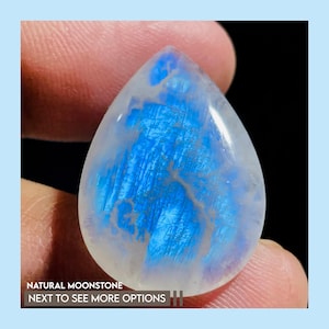 Natural Rainbow Moonstone Cabochons, hand-selected for their stunning blue fire and rainbow flash.