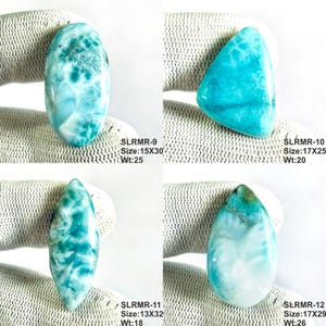 May include: Four polished Larimar gemstones in various shapes including oval, triangular, marquise, and teardrop. Each stone displays a vibrant sky-blue color with white marbled patterns. Text labels include SLRMR-9, 10, 11, 12 with sizes in mm.