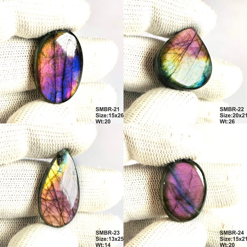 May include: Four polished labradorite gemstones in various shapes, each displaying iridescent colors of purple, blue, and yellow. The gemstones are held against a white background. Text on the image indicates sizes and weights in millimeters and grams.