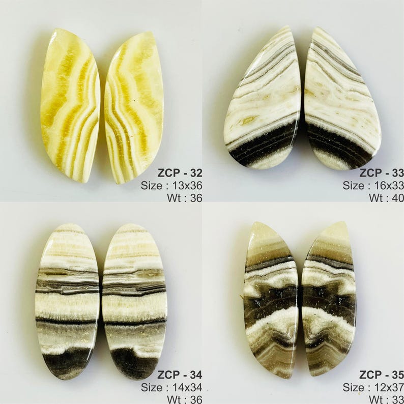 May include: Four pairs of polished gemstone cabochons in various shapes. The stones feature a mix of cream, brown, and black banding. The text on the image indicates sizes ranging from 12x37 to 16x33, and weights from 33 to 40.