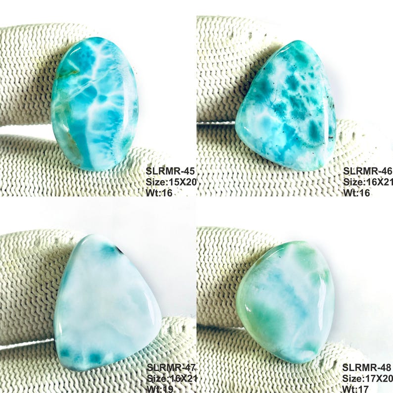 May include: Four polished larimar gemstones with blue and white marbled patterns. Each stone is labeled with codes and dimensions in mm: SLRMR-45 15x20, SLRMR-46 16x21, SLRMR-47 16x21, and SLRMR-48 17x20. The stones display varied cloud-like textures and hues.