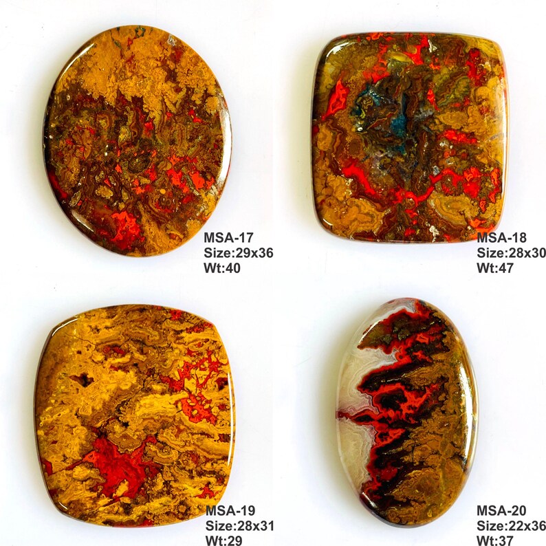K&ouml;nnte beinhalten: Vier polierte Cabochon-Edelsteine mit wirbelnden Mustern in Braun, Gold und leuchtendem Rot. Jeder Stein ist mit den Codes MSA-17, MSA-18, MSA-19 und MSA-20 beschriftet, einschlie&szlig;lich der Abmessungen in mm und des Gewichts in Karat.