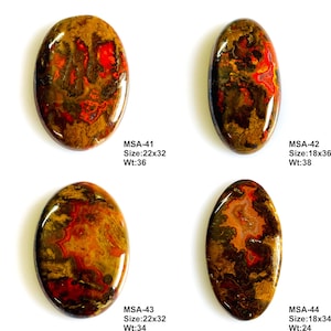 K&ouml;nnte beinhalten: Vier polierte ovale Cabochons mit wirbelnden Mustern in Dunkelbraun, Schwarz und leuchtendem Rot. Jeder Stein ist mit Codes beschriftet: MSA-41 (22x32, 36), MSA-42 (18x36, 38), MSA-43 (22x32, 34) und MSA-44 (18x34, 24) f&uuml;r Gr&ouml;&szlig;e und Gewicht.