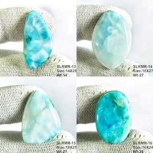 May include: Four polished Larimar cabochons with blue and white marbled patterns. Top left: SLRMR-13, 14x28. Top right: SLRMR-14, 18x27. Bottom left: SLRMR-15, 18x25. Bottom right: SLRMR-16, 16x24. Each stone displays unique oceanic color variations.