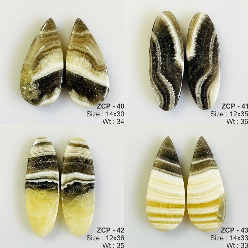 May include: Four pairs of polished gemstone cabochons. Each pair has a unique pattern of brown, white, and black swirls. The shapes include teardrop and oval. The text on the image indicates sizes and weights.