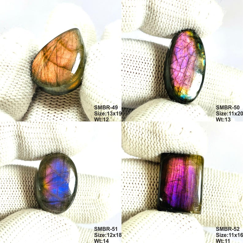 May include: Four polished labradorite gemstones in various shapes: teardrop, oval, and rectangular. The stones display iridescent flashes of purple, pink, and gold. Each stone has a size and weight listed: SMBR-49, SMBR-50, SMBR-51, and SMBR-52.