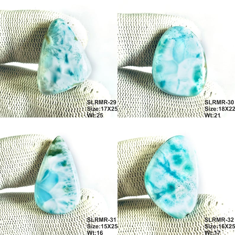 May include: Four polished larimar gemstones with blue and white patterns. Each stone is labeled with text: SLRMR-29 Size:17X25 Wt:25, SLRMR-30 Size:18X22 Wt:21, SLRMR-31 Size:15X25 Wt:16, and SLRMR-32 Size:16X25 Wt:17, indicating specific dimensions.