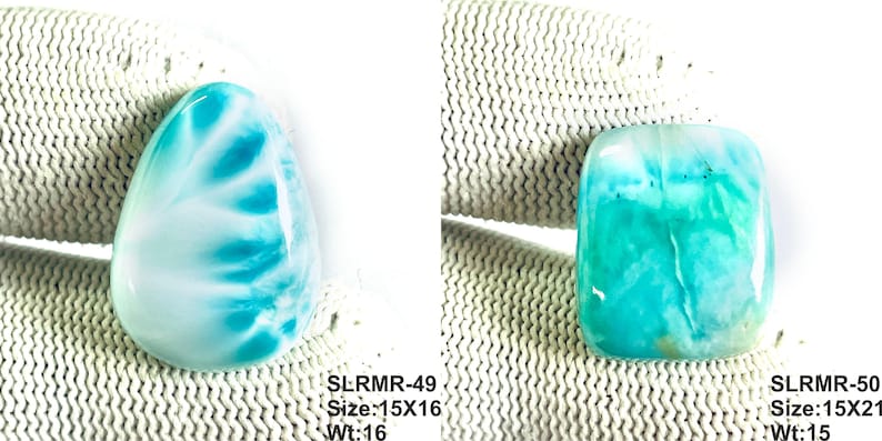 May include: Two polished larimar gemstones. The left stone is teardrop-shaped with white and cyan patterns, labeled SLRMR-49, 15x16, Wt:16. The right stone is rectangular with rounded corners, cyan and white hues, labeled SLRMR-50, 15x21, Wt:15.