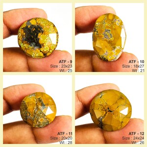 May include: Four faceted gemstones with yellow, brown, and black patterns. Each stone is held by a hand. The text on the image indicates sizes of 23x23, 18x27, 20x20, and 24x24, and weights of 25, 21, 28, and 26.