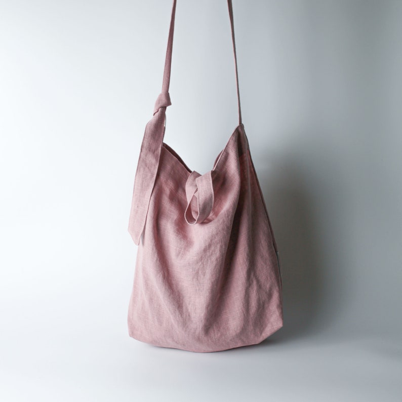 Urban French natural linen hobo crossbody bag featuring top handles, an internal zip pocket and an adjustable shoulder strap Pink