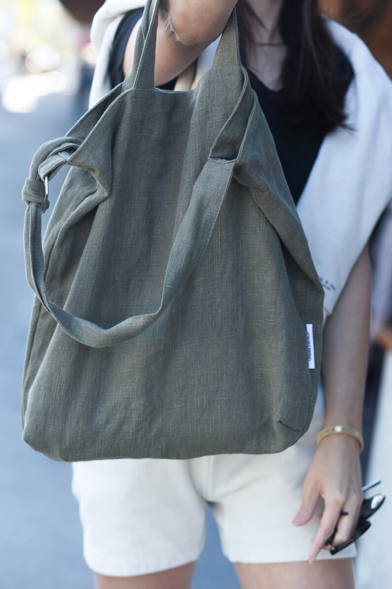 Urban French natural linen hobo crossbody bag featuring top handles, an internal zip pocket and an adjustable shoulder strap image 10
