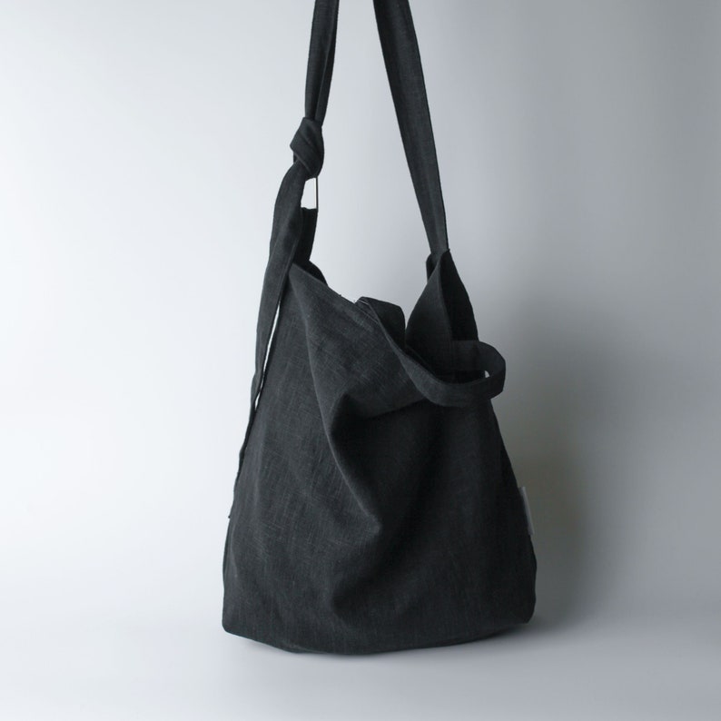 Urban French natural linen hobo crossbody bag featuring top handles, an internal zip pocket and an adjustable shoulder strap Black