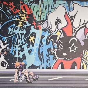 May include: Three figures stand in front of a colorful graffiti wall. The wall features a black and white cartoon character with a red and white body. The figure on the left is wearing a black jacket, black pants, and a black hat. The figure in the middle is wearing a purple shirt, blue shorts, and a black hat. The figure on the right is wearing a gray shirt and blue jeans.